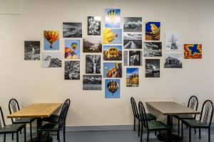 Evelyn's Kitchen Table photos on wall